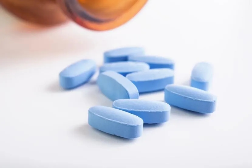 Brenzavvy New Diabetes Drug - a bottle of blue pills sitting on top of a white table next to a bottle of blue pills on top of a white table