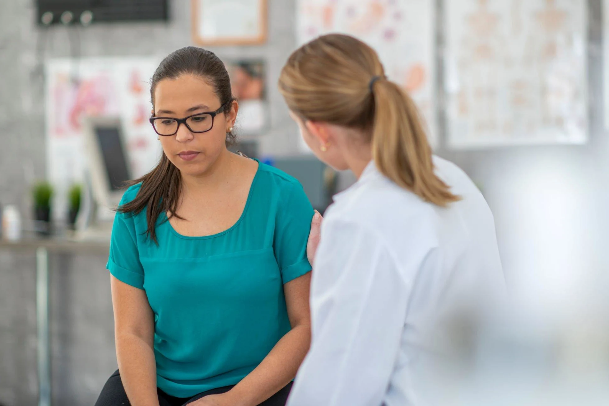 Breaking the Silence: Diabetes and Mental Health A young woman looks at the floor nervously while her hands rest on her lap. Her doctor sits across from her telling her some bad news